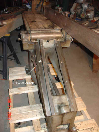 View of crack in jointer sled stay.
