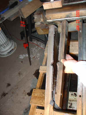 View of stay cracked off of infeed sled base.