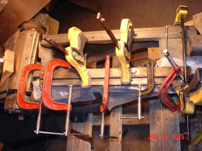 Clamping the infeed sled stay back into position with glue!